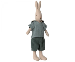 A Maileg Rabbit, Size 2 - Classic Shirt & Shorts, crafted from soft natural linen, wears a light blue shirt with a hood and dark green shorts. The rabbit stands upright with its long ears pointing up and has a simple, stitched facial expression. Perfect for any Maileg dollhouse collection.