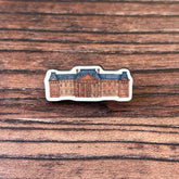 The Edinburgh College of Art wooden pin badge.